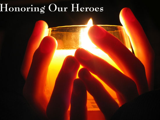 hands holding memorial candle