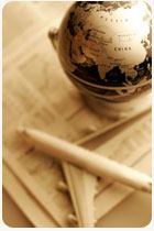 globe of world with airplane and newspaper